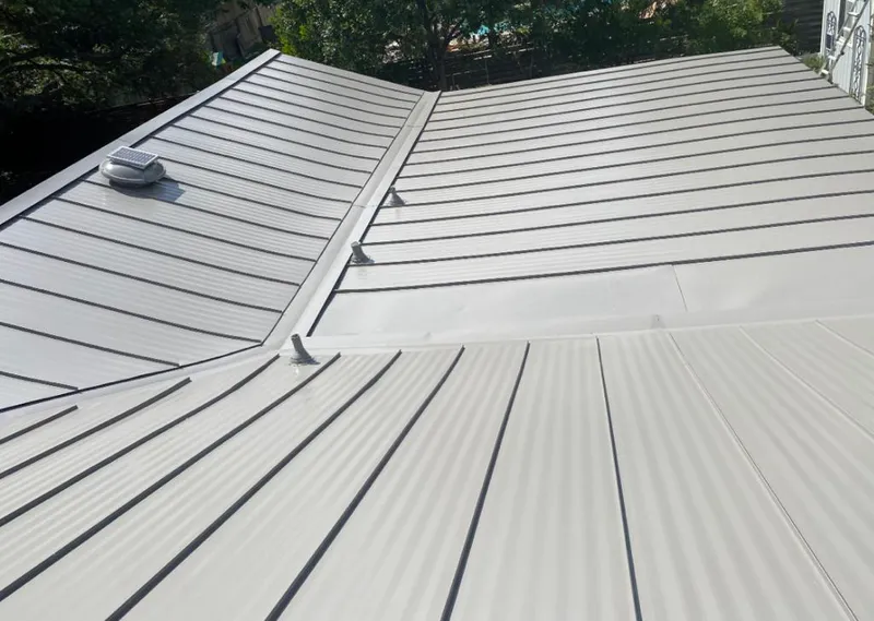 Solar attic fan installed on a metal roof for Roof Ventilation in Port Orange